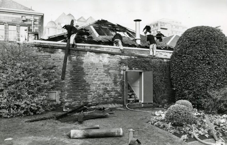 Firefighters at work on the roof of a lab in the University of Dundee after a fire.