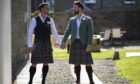 Kilted yoga star Finlay Wilson - on the right -married Alan Lambie on May 29, 2020.
