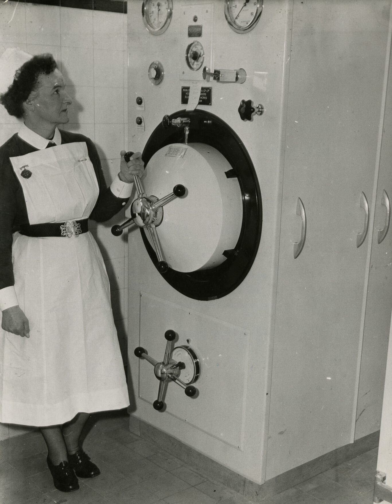a nurse beside a machine in the Dundee Royal Infirmary maternity department in May 1962