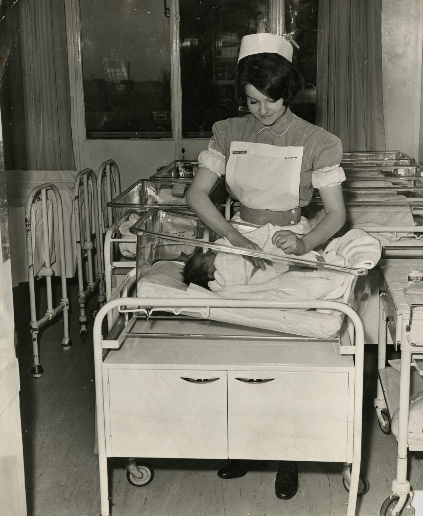 Student nurse Edith Doig attends to a newborn baby at Maryfield Hospital in 1968.
