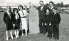 Rector Peter Murphy and pupils beside the school monolith in August 1985. Image: DC Thomson.