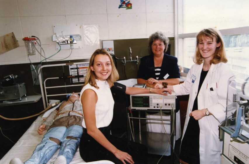 Dr Alison Leech having her blood pressure taken by senior house officer Suzy Gibson at the Ward 20 open day at DRI in June 1996.