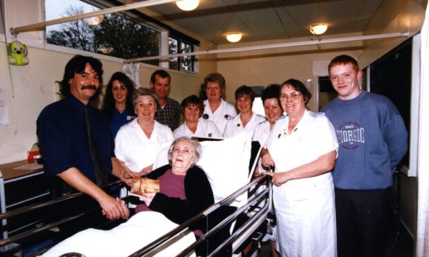 DRI final out-patient, Isabella Ivy, with nursing staff in November 1998.