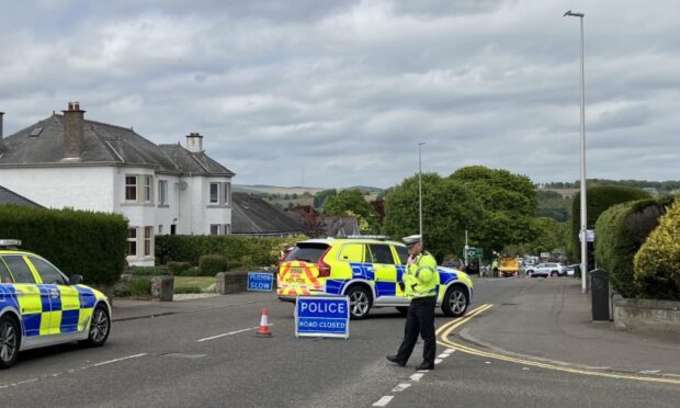 Officers at the scene of the pedestrian crash on Old Glamis Road in Dundee