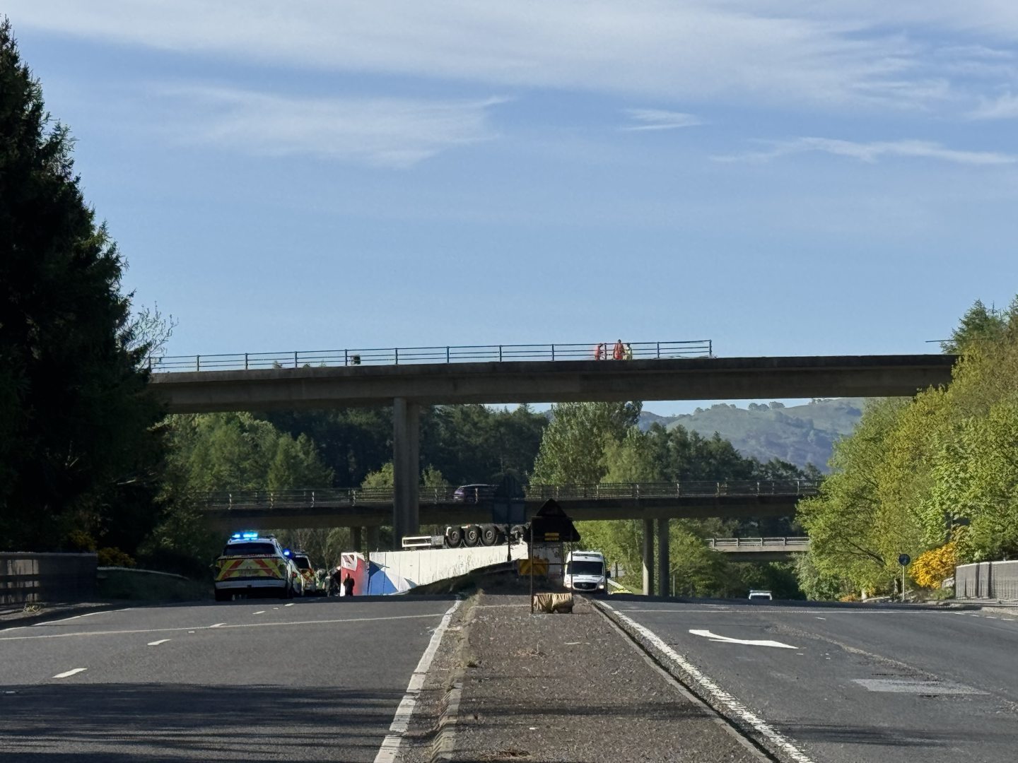 Lorry crash through M90 barriers.