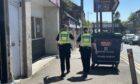 Police on High Street in Cowdenbeath after the discovery of another cannabis farm. Image: Neil Henderson/DC Thomson