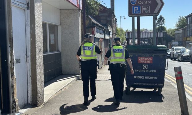 Police on High Street in Cowdenbeath after the discovery of another cannabis farm. Image: Neil Henderson/DC Thomson