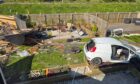 The car sat in the garden shortly after the crash.