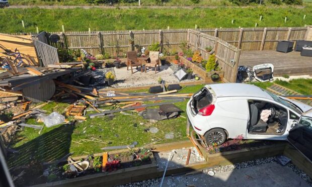 To go with story by Ellidh Aitken. car crashed into garden at macquarrie crescent, dunfermline Picture shows; car crashed into garden at macquarrie crescent, dunfermline. dunfermline. Supplied by Neil Henderson/DC Thomson Date; 08/05/2025