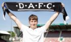 Dunfermline Athletic youngster Jake Sutherland holds up a DAFC scarf.