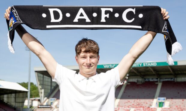 Dunfermline Athletic youngster Jake Sutherland holds up a DAFC scarf.