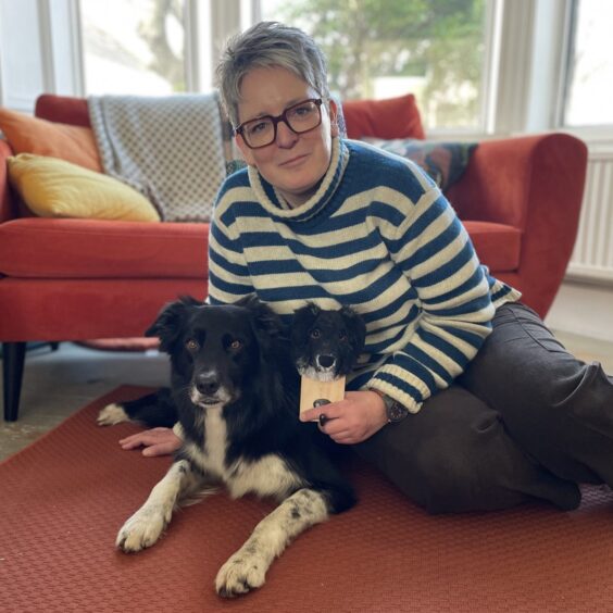 Jen Black of wooltide with a model dog and her black and white collie who inspired it. Jen will be taking part in East Neuk Open Studios 2025.