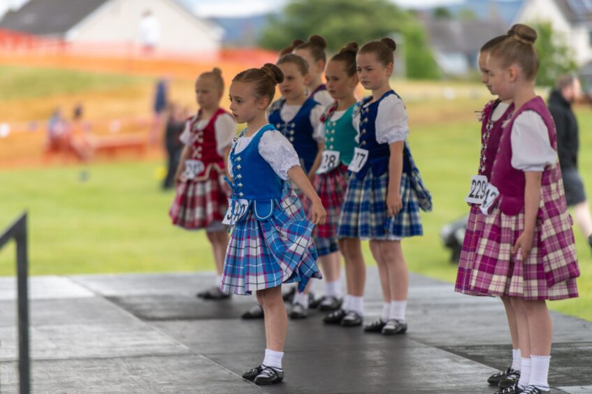 Young Highland dancers on stage