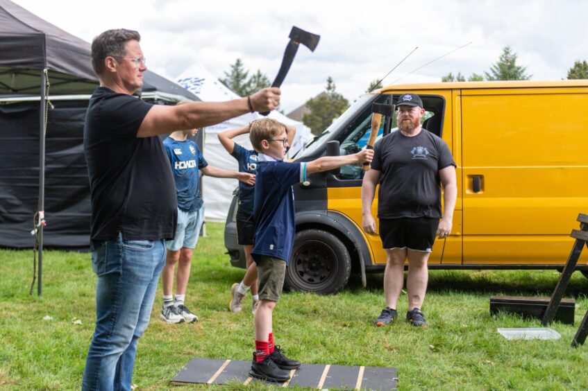 People try axe-throwing