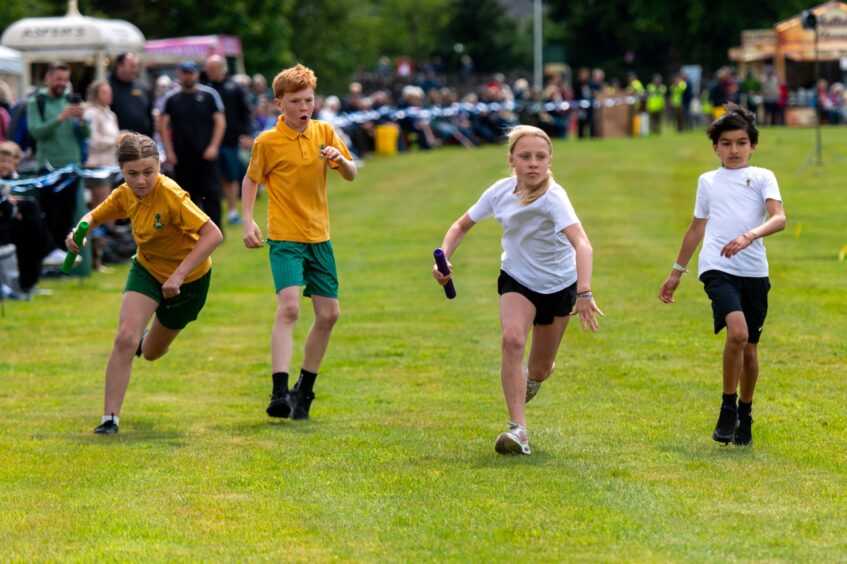 Children running a relay race