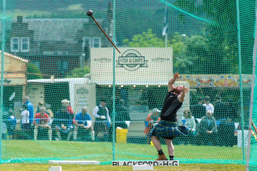 Jamie Gunn throws a hammer.