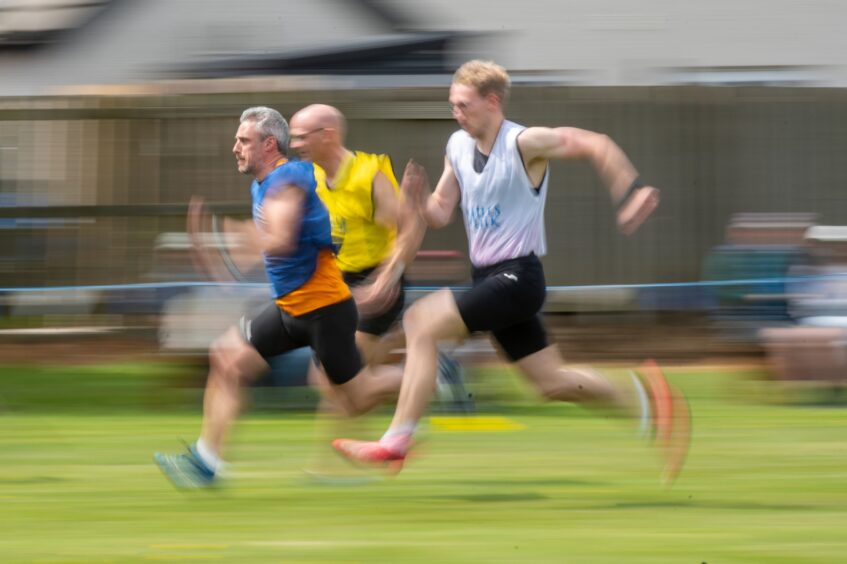 Three men run a race