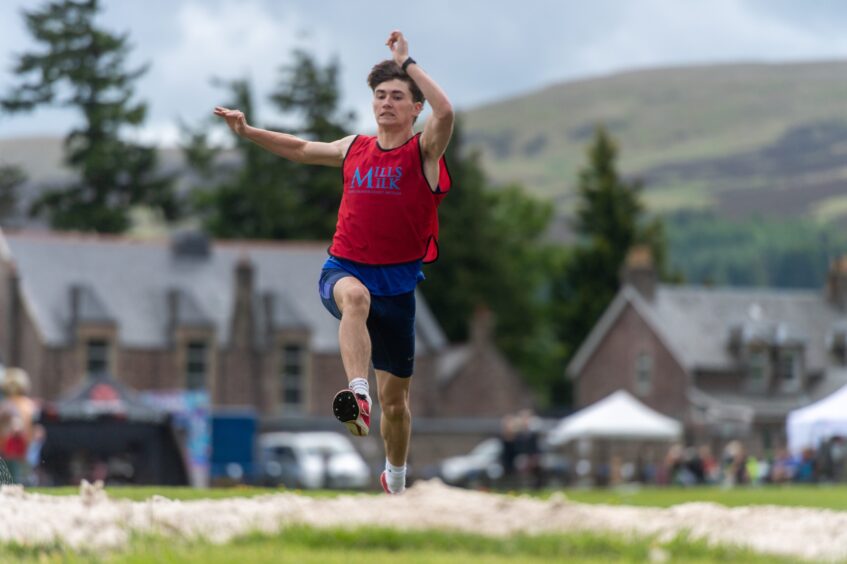 Stuart Whiteford leaps in the triple jump.