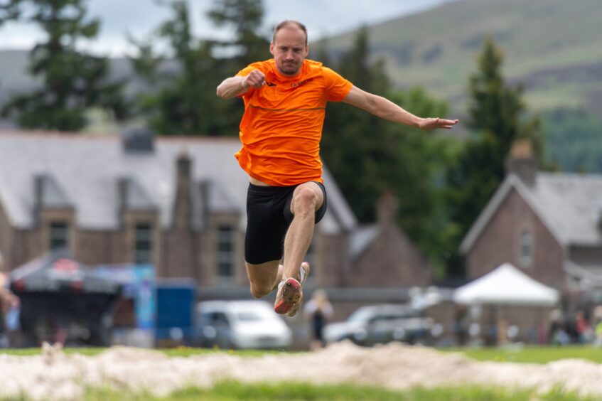 Allan Hamilton takes part in the triple jump.