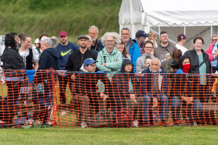 Crowds watch the Blackford Highland Games.