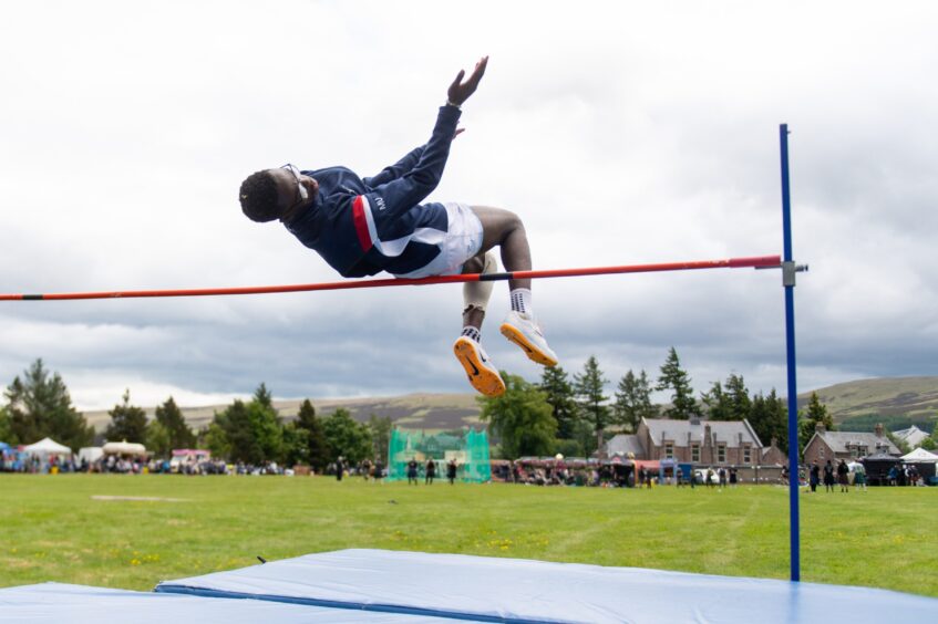 Michael Ubiobor clears the bar in the high jump.
