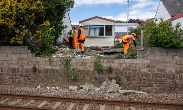 Workers trying to remove debris near Ireland Street, Carnoustie.