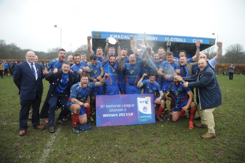 Champagne is sprayed as Kirkcaldy celebrate on the pitch after winning the BT National League Division 2 title.