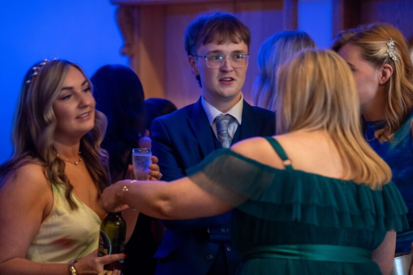 Revellers mingle at the event.