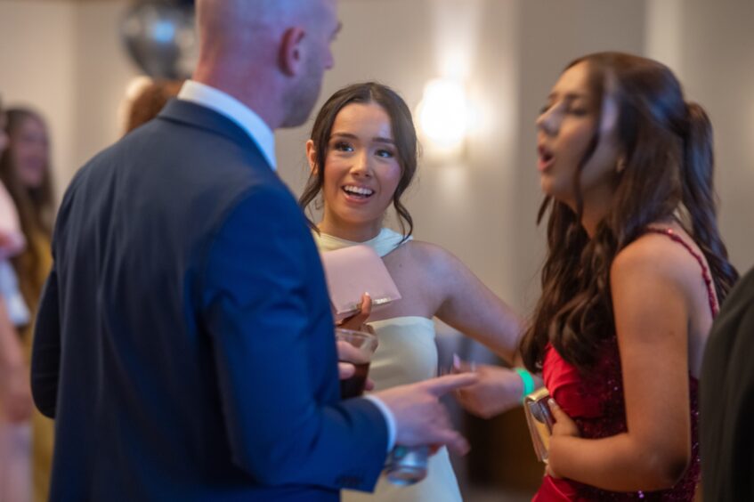 Revellers chat at the event