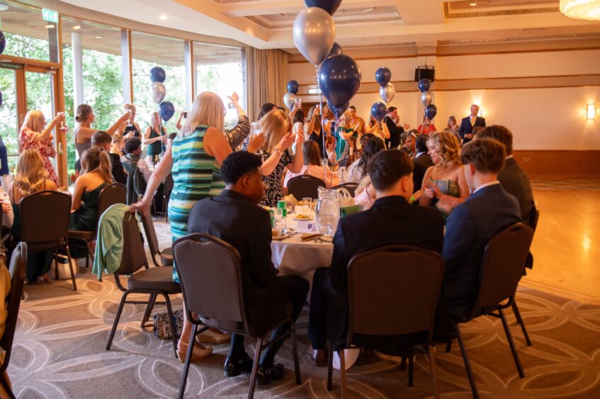 Teachers toast the class of 2025.