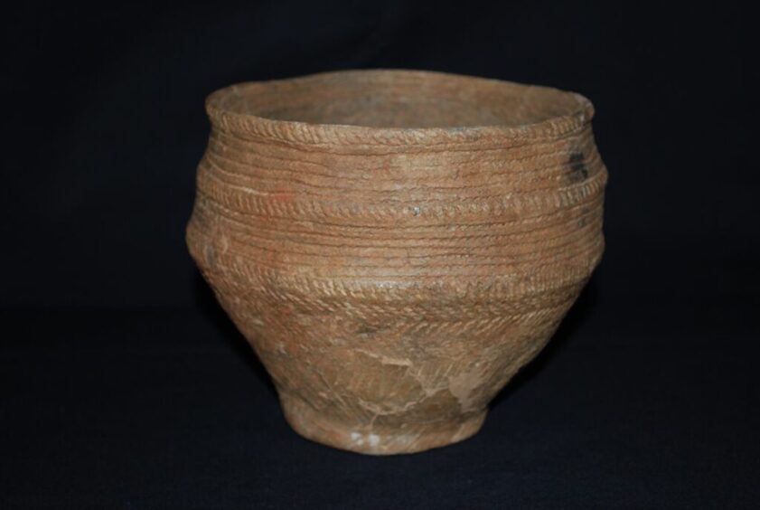 Image shows: a bronze age food vessel from St Andrews Museum exhibition.