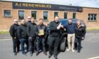 AJ Renewables Owner Alistair Galloway in his Lochgelly office and surrounded by his team. Image: Kenny Smith/DC Thomson
