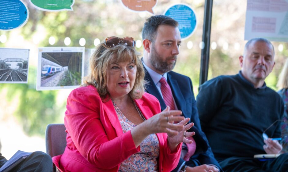 Transport minister Fiona Hyslop speaks to Newburgh train station campaign members
