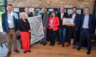 Trnasport minister Fiona Hyslop, centre, with MSPs and members of the Newburgh Train Station Campaign