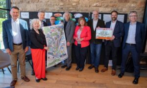 Trnasport minister Fiona Hyslop, centre, with MSPs and members of the Newburgh Train Station Campaign