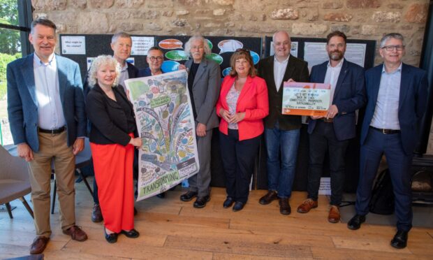Trnasport minister Fiona Hyslop, centre, with MSPs and members of the Newburgh Train Station Campaign