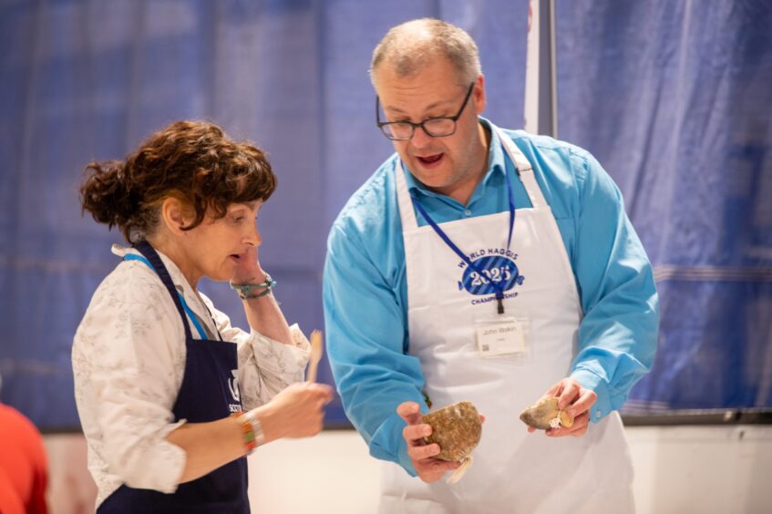 Morag Lindsay looking at haggis sliced in two by Jon Wilkin