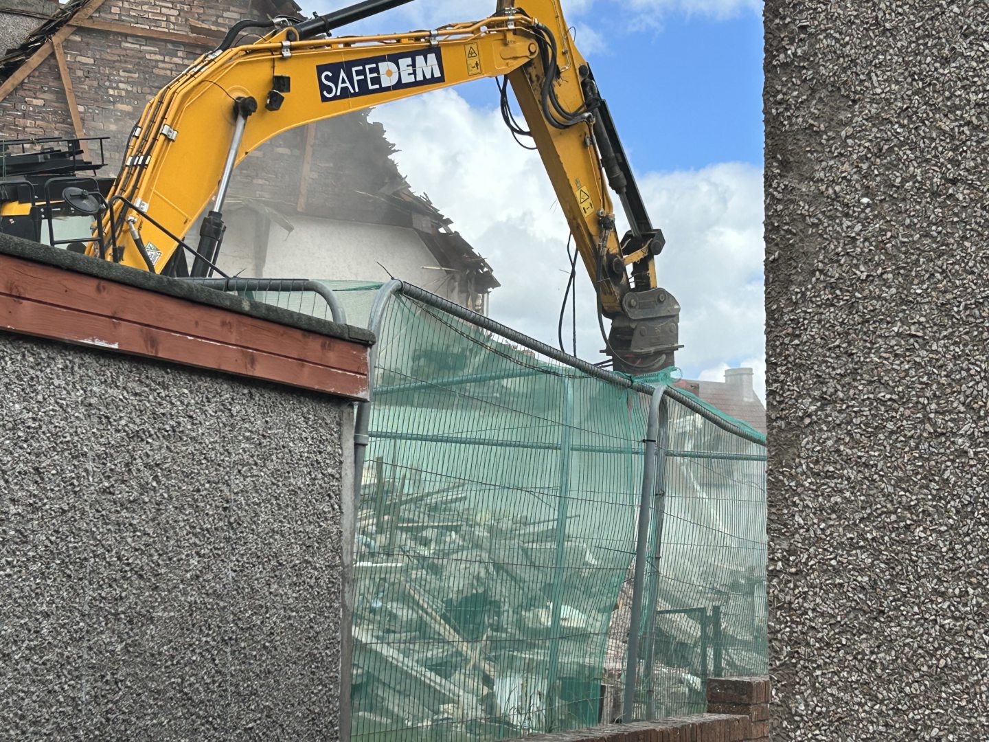 The first house was demolished in just a few minutes.