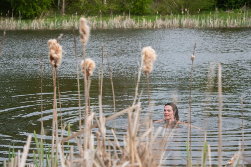 Gayle swims at the pond at the wild sauna at Forbes of KIngennie