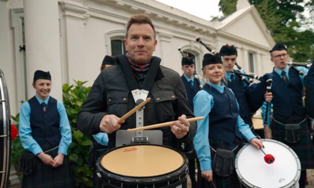 Ewan McGregor is joined by the Morrison's Academy Pipe Band at his £2 million Glencarse mansion in Long Way Home.