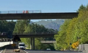 The lorry has crashed through a barrier on the M90 flyover and landed on the road below. Image: Lucy Scarlett/DC Thomson
