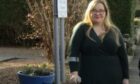 Fife Councillor Louise-Kennedy-Dalby uses a crutch while standing outside