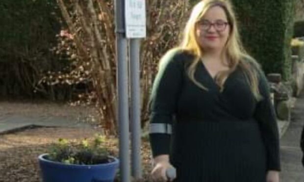 Fife Councillor Louise-Kennedy-Dalby uses a crutch while standing outside