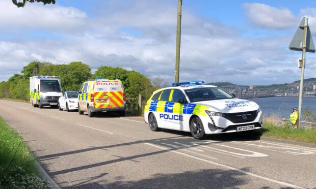 Emergency services attending an incident on the shoreline near Tayport.