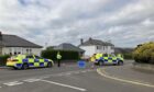Police have shut Old Glamis Road following the collision