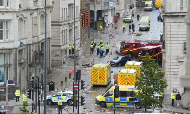 Police and emergency services at the scene of the incident on Water Street. Image: PA