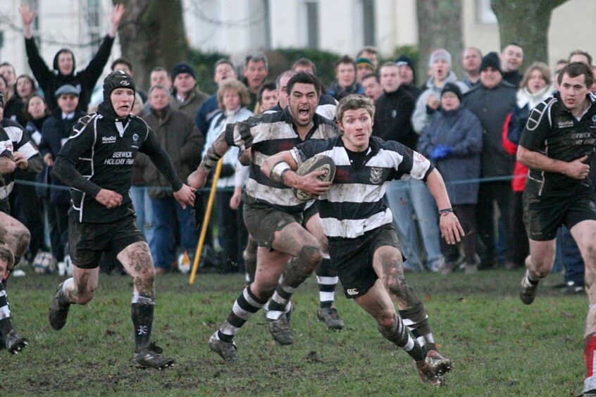 The crowd cheers in the background as Perthshire’s Joe Hickman runs in his third try in his side’s 27-7 home win over Berwick in Premier Division Three in December 2006.