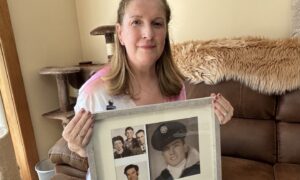 Paula Colville at her Lochgelly home holding photos of her Mafia-linked father.