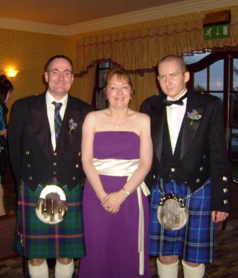 William pictured three months after his stem cell transplant with his mum and her partner Andy.