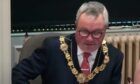 Newly-appointed Angus Provost Craig Fotheringham during the council clash. Image: Angus Council/You Tube
